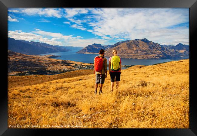 Adventure couple on vacation hiking trip South Island Framed Print by Spotmatik 