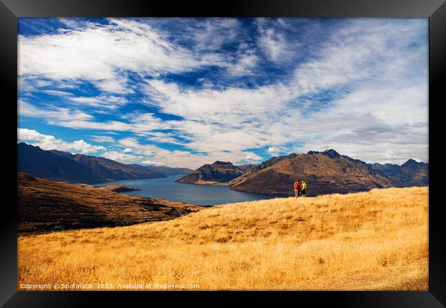 Adventure couple on vacation hiking trip South Island Framed Print by Spotmatik 