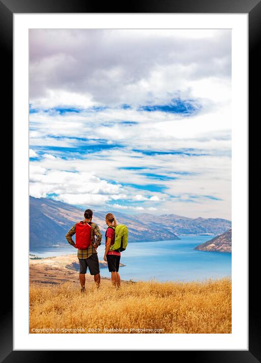 New Zealand Male female hikers trekking The Remarkables Framed Mounted Print by Spotmatik 