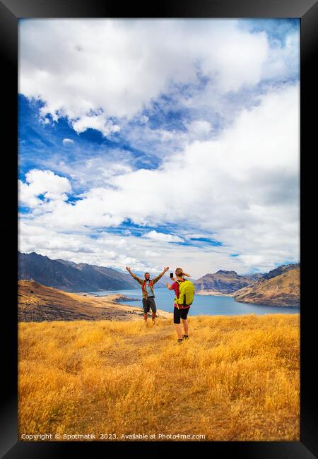 Queenstown girl taking smart phone picture New Zealand  Framed Print by Spotmatik 