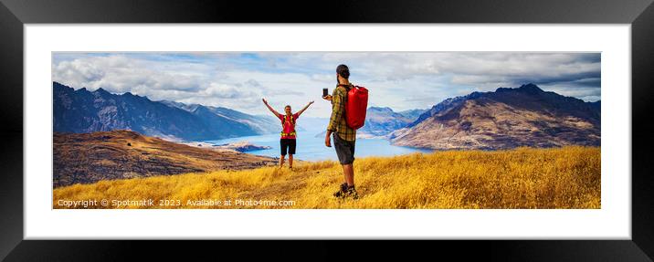Panorama of young backpacking couple taking smartphone photo  Framed Mounted Print by Spotmatik 