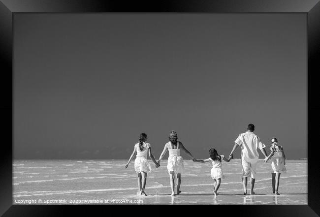 Happy travel family on tropical beach enjoying leisure Framed Print by Spotmatik 