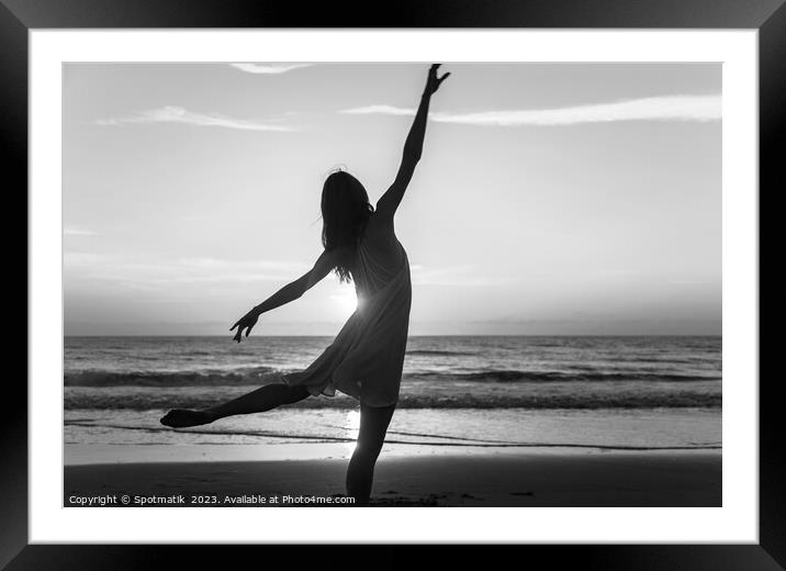 Sunset view carefree young girl dancing on beach Framed Mounted Print by Spotmatik 