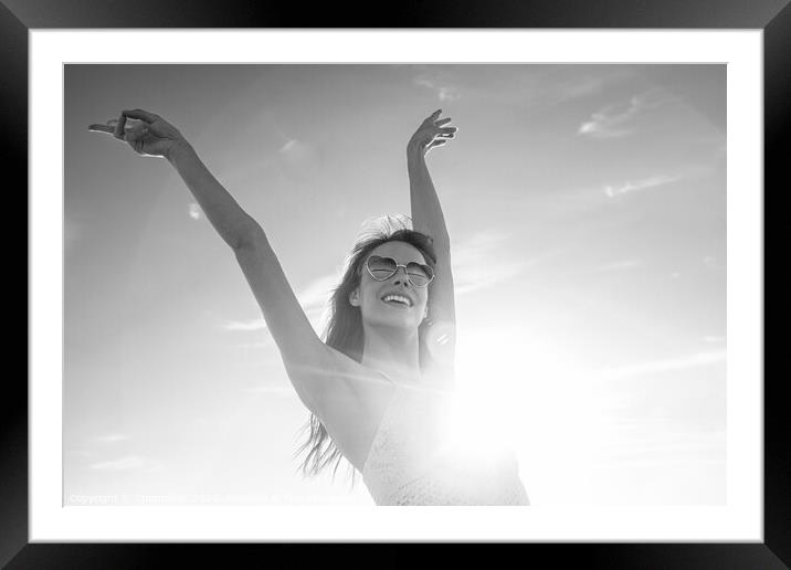 Bohemian girl dancing at festival on beach vacation Framed Mounted Print by Spotmatik 
