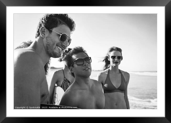 Friends on beach going bodyboarding on Summer vacation Framed Mounted Print by Spotmatik 