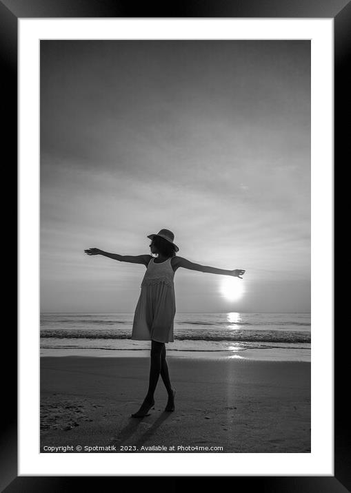 African American woman dancing on beach at sunset Framed Mounted Print by Spotmatik 