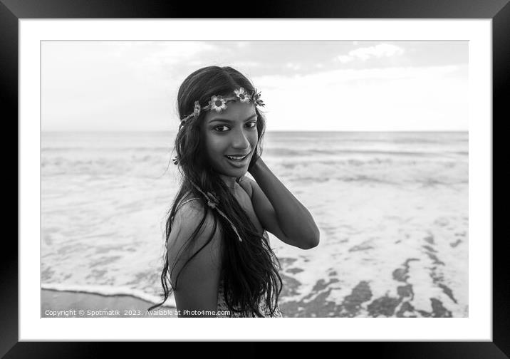 Indian woman by the ocean wearing flower headband Framed Mounted Print by Spotmatik 