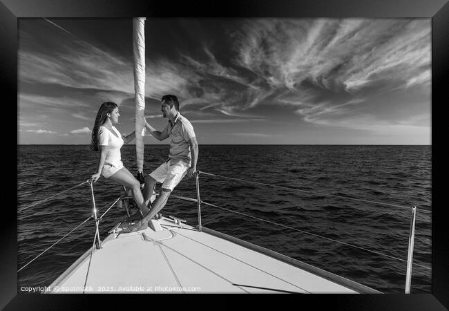 Hispanic couple enjoying luxury travel on private yacht Framed Print by Spotmatik 