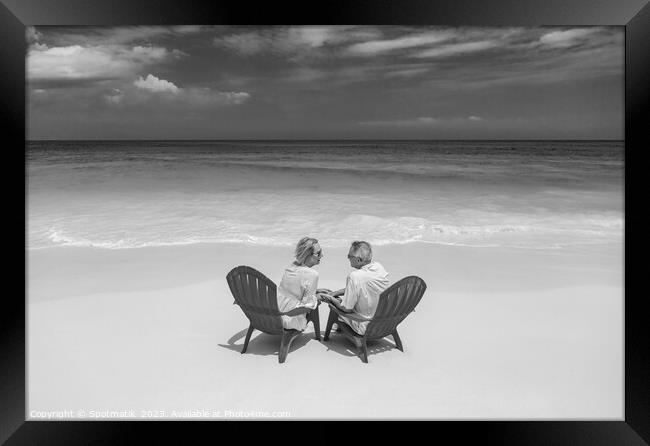 Turquoise ocean view for retired couple on beach Framed Print by Spotmatik 