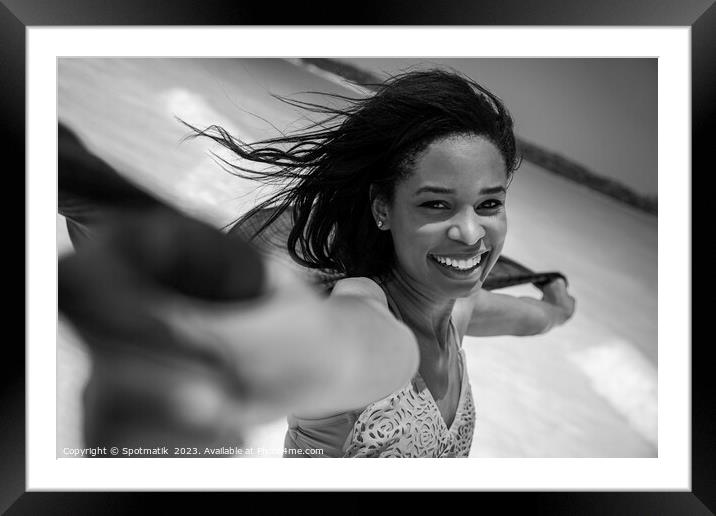 Close up smiling girl on beach holding scarf Framed Mounted Print by Spotmatik 