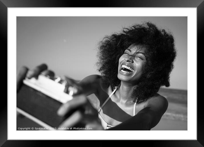 Afro girl laughing at camera taking fun selfie Framed Mounted Print by Spotmatik 