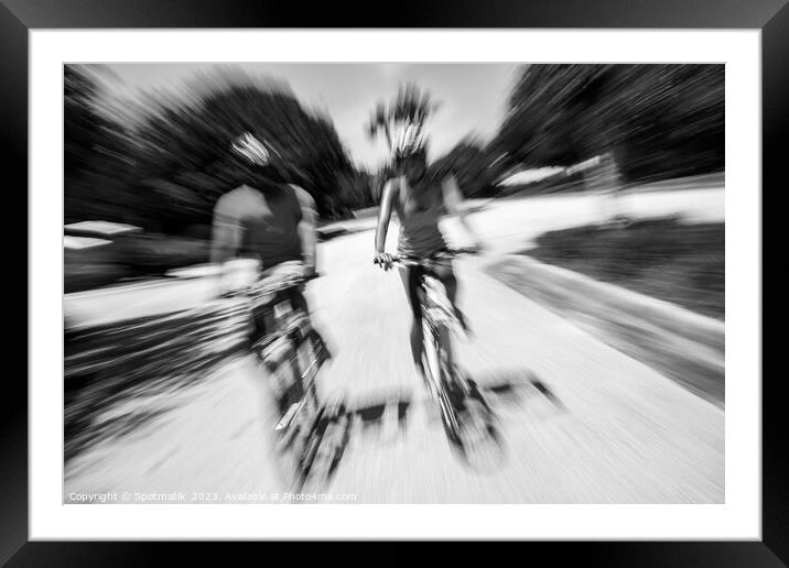 Afro American cyclists riding bikes in motion blur Framed Mounted Print by Spotmatik 