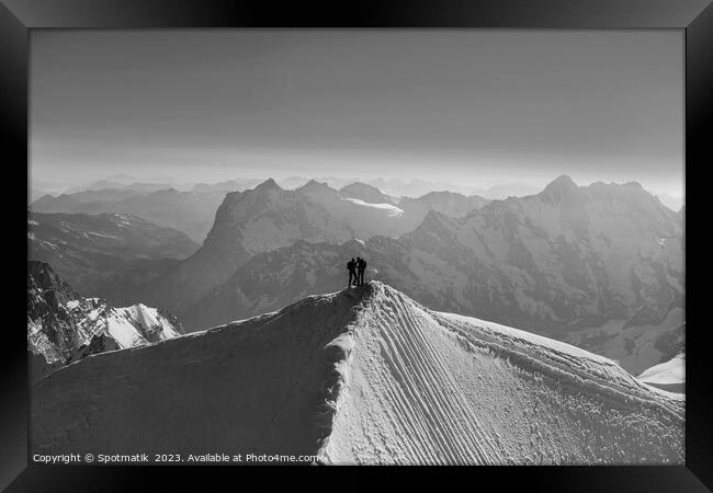 Aerial Switzerland two climbers on mountain summit Europe Framed Print by Spotmatik 