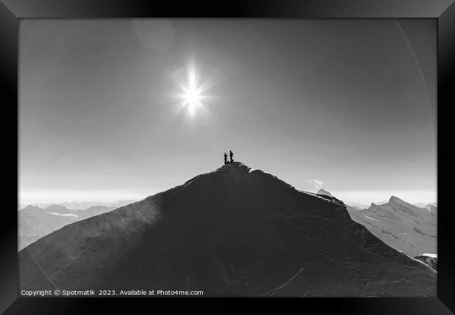 Aerial view Switzerland climbers on mountain summit Europe Framed Print by Spotmatik 