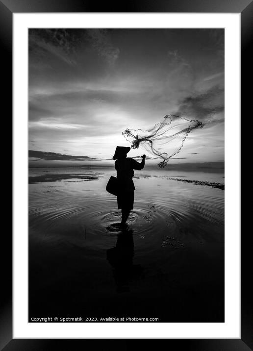 Balinese fisherman casting net Flores sea at sunrise Framed Mounted Print by Spotmatik 