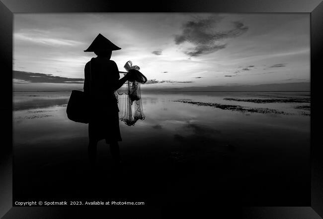 Silhouette Balinese male fishing Indonesian coastline at sunrise Framed Print by Spotmatik 