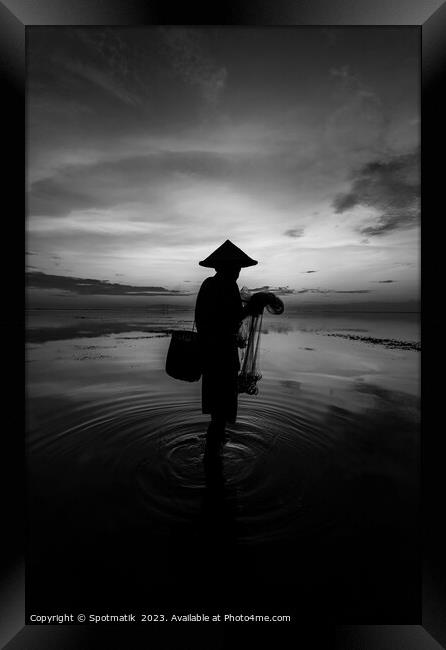 Sunrise Balinese male net fishing Flores sea coastline  Framed Print by Spotmatik 