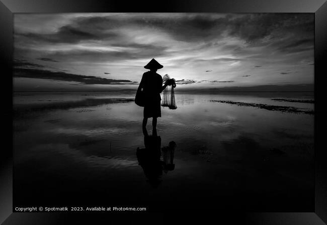 Silhouette Balinese male fishing Indonesian coastline at sunrise Framed Print by Spotmatik 