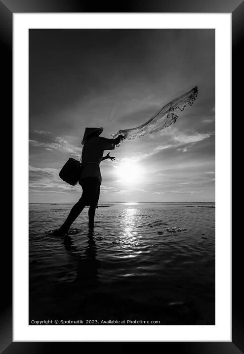 Silhouette Balinese sunrise fisherman casting net Flores sea Framed Mounted Print by Spotmatik 