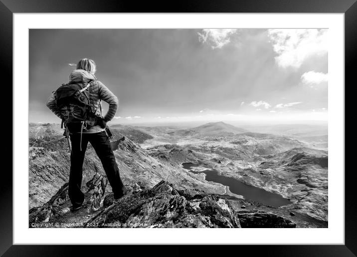 Young female backpacker on hiking vacation Wales Framed Mounted Print by Spotmatik 