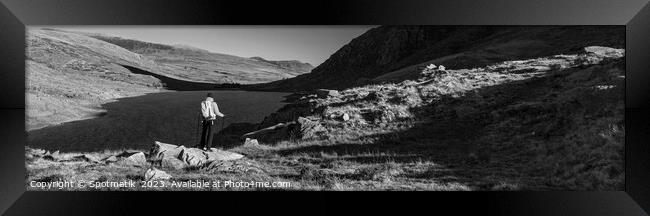 Panoramic lake among mountains with female hiker Snowdonia Framed Print by Spotmatik 