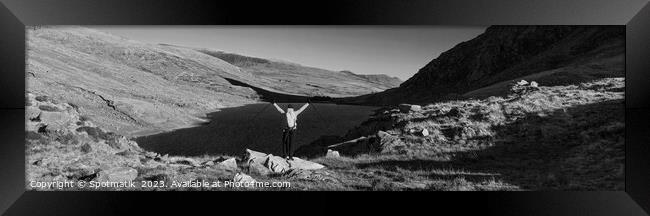 Panoramic female backpacker enjoying scenic lake view Snowdonia Framed Print by Spotmatik 