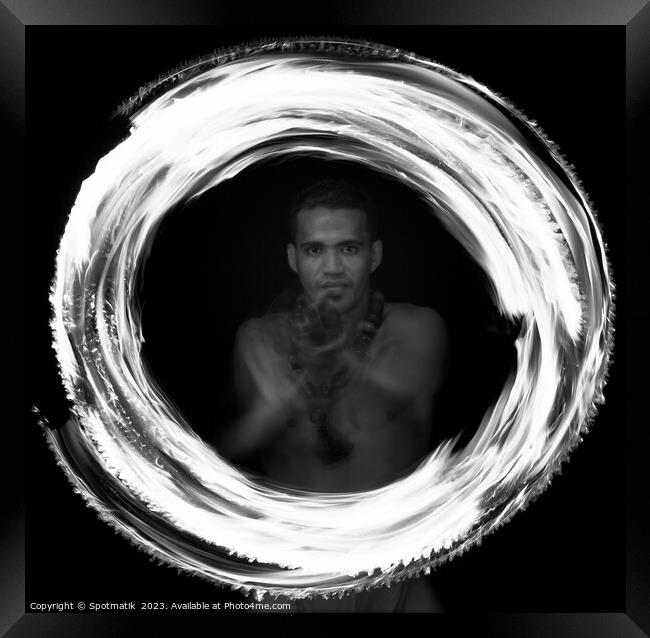 Male Polynesian Fire dancer performing Ring of Fire  Framed Print by Spotmatik 