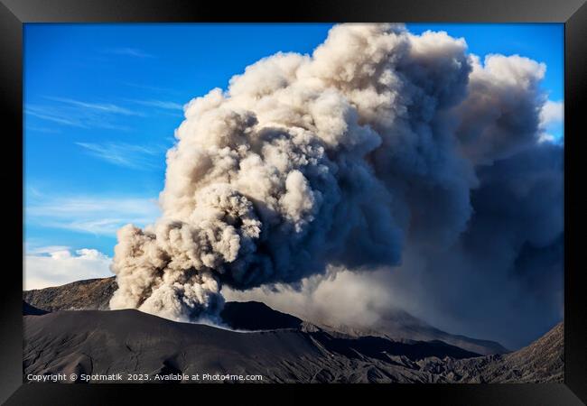 Erupting smoke and ash from Mount Bromo summit  Framed Print by Spotmatik 