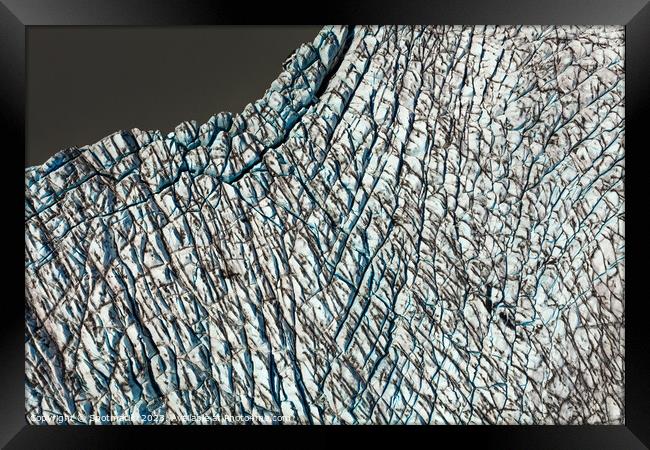 Aerial view ice crevasses frozen glacier Alaska USA Framed Print by Spotmatik 