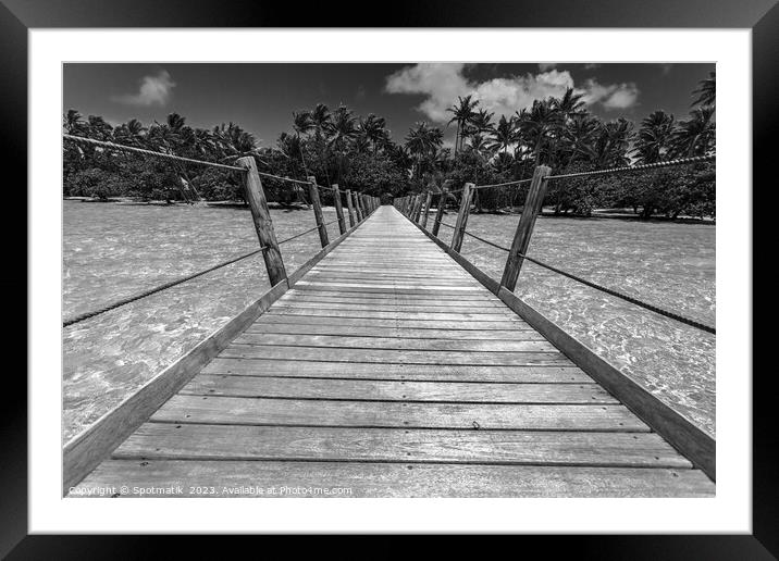 Bora Bora wooden walkway over tropical Aquamarine lagoon  Framed Mounted Print by Spotmatik 