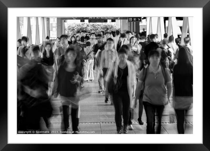 Asian city commuters walking to work Hong Kong Framed Mounted Print by Spotmatik 