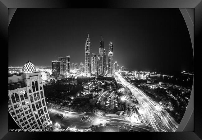 Night illuminated view Skyscrapers Sheikh Zayed road Dubai  Framed Print by Spotmatik 