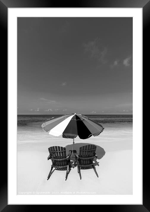 Bahamas beach umbrella and chairs on sandy beach  Framed Mounted Print by Spotmatik 