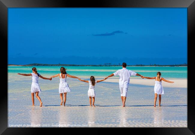 Healthy Caucasian family together on beach vacation Bahamas Framed Print by Spotmatik 