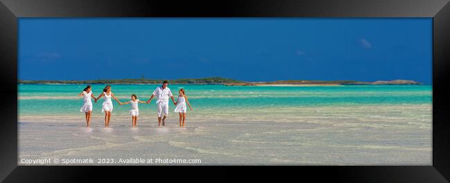 Panorama of mother father with family walking on beach  Framed Print by Spotmatik 