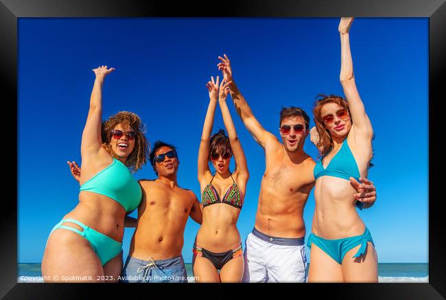 Beach party fun friends in swimwear enjoying vacation Framed Print by Spotmatik 