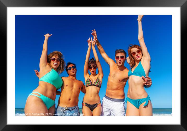 Beach party fun friends in swimwear enjoying vacation Framed Mounted Print by Spotmatik 