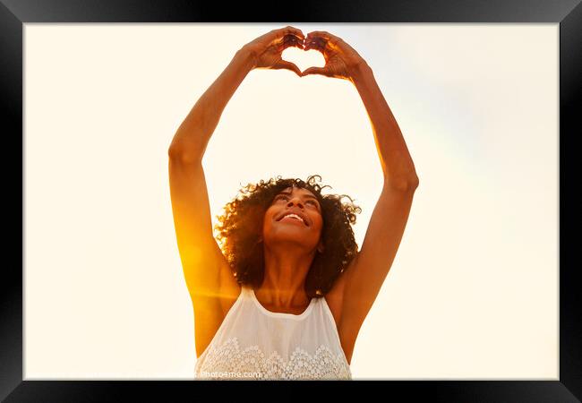 Afro American girl showing heart sign with hands Framed Print by Spotmatik 