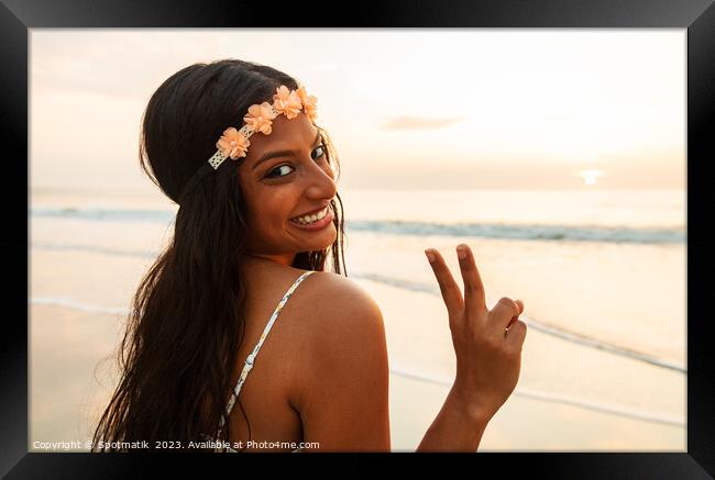 Happy Indian girl enjoying freedom outdoors on beach Framed Print by Spotmatik 