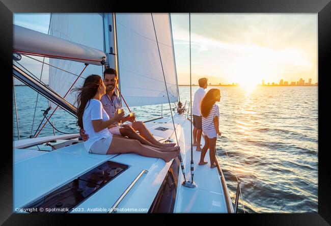 Fun family vacation on luxury yacht at sunrise Framed Print by Spotmatik 