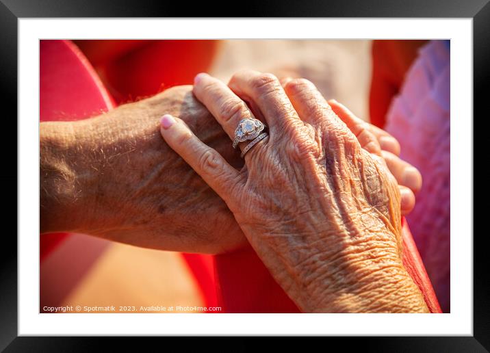 Linked hands of senior Caucasian couple on vacation Framed Mounted Print by Spotmatik 