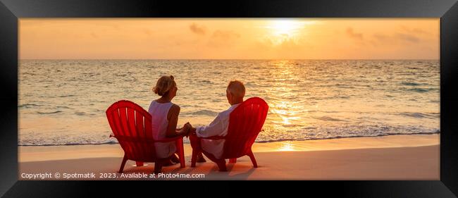 Panoramic ocean view with mature couple sitting together Framed Print by Spotmatik 