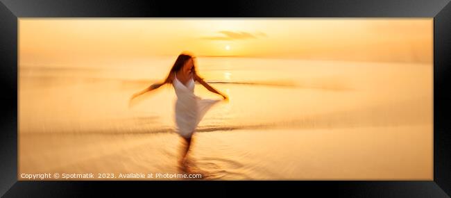 Panoramic motion blurred ocean sunset with dancing girl Framed Print by Spotmatik 