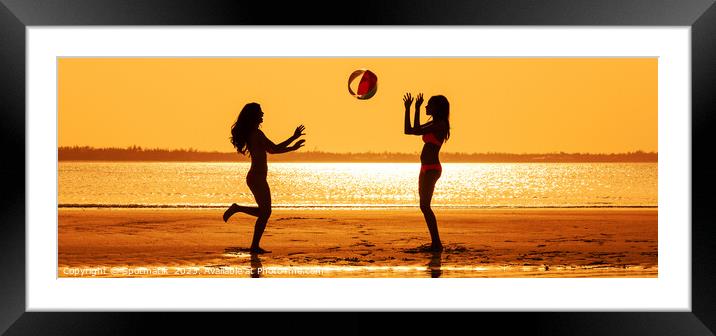 Panoramic silhouette friends with beach ball at sunset Framed Mounted Print by Spotmatik 