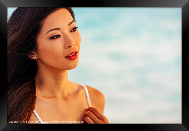 Close up of beautiful Asian girl on vacation Framed Print by Spotmatik 