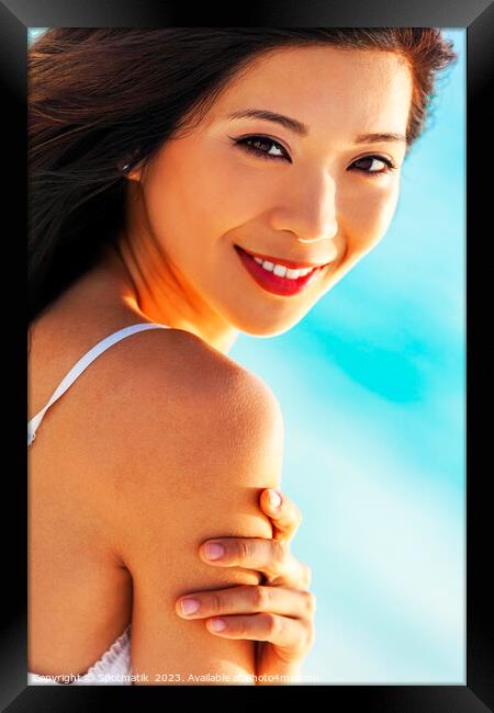 Portrait of smiling Asian girl on relaxing vacation Framed Print by Spotmatik 