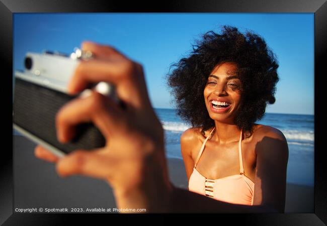 Laughing African American girl taking selfie on beach Framed Print by Spotmatik 