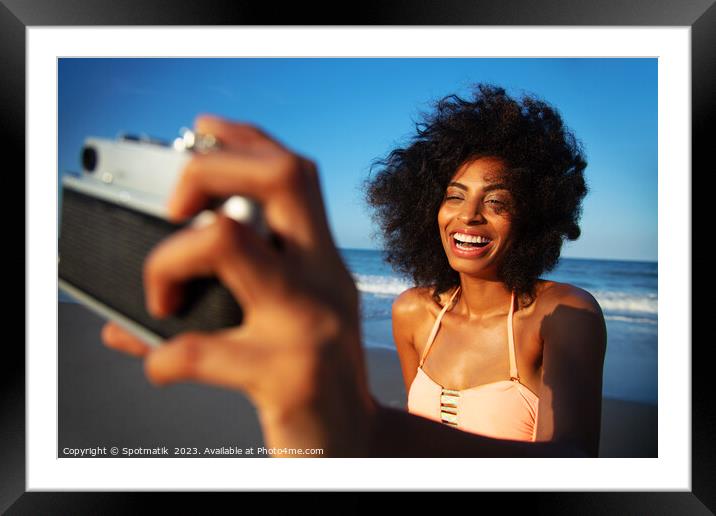 Laughing African American girl taking selfie on beach Framed Mounted Print by Spotmatik 