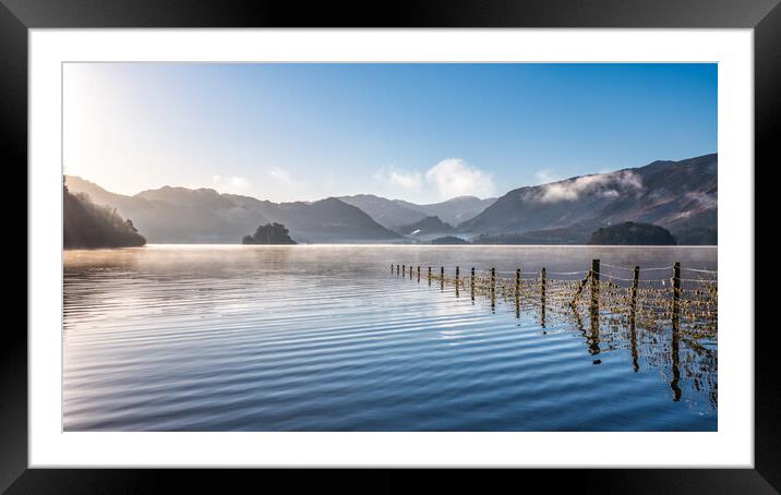 Derwent Water in Winter misty sky and sunrays shin Framed Mounted Print by Julian Carnell