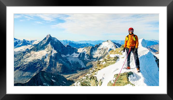 Alpine climber on the summit of Dent Blanche Framed Mounted Print by Julian Carnell